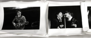 stack of photos of the Beatles taken by Michael Mitchell