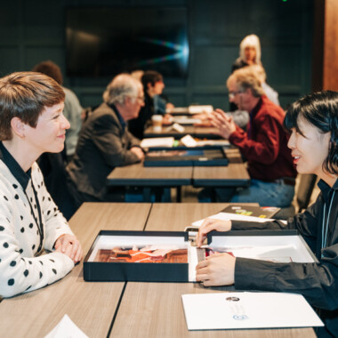 Portfolio review, reviewer and photographer sitting at table
